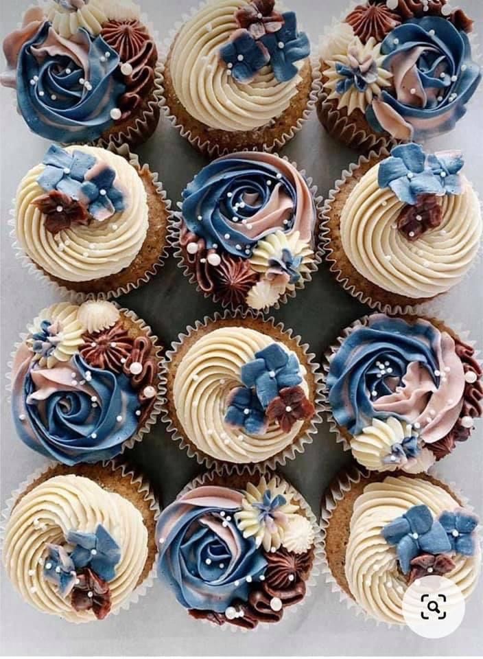 several cupcakes with blue and white frosting on top are arranged in a circle