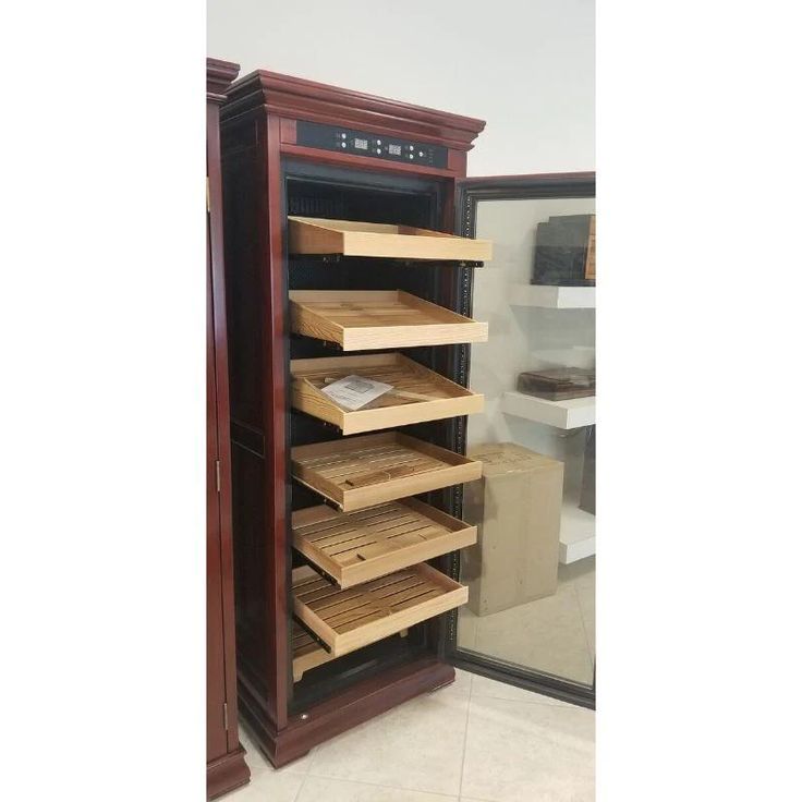 a large wooden cabinet with several shelves in it