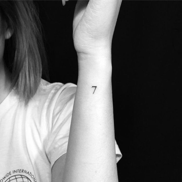 a woman with a small tattoo on her arm