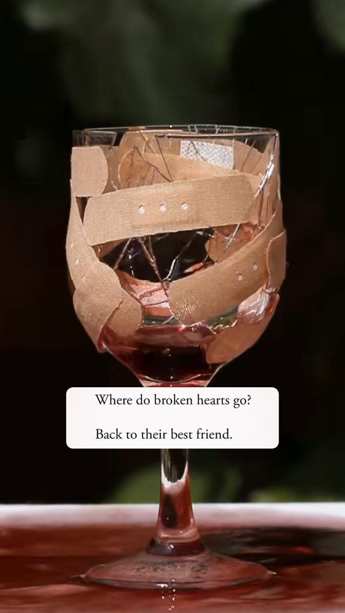 a broken wine glass sitting on top of a table