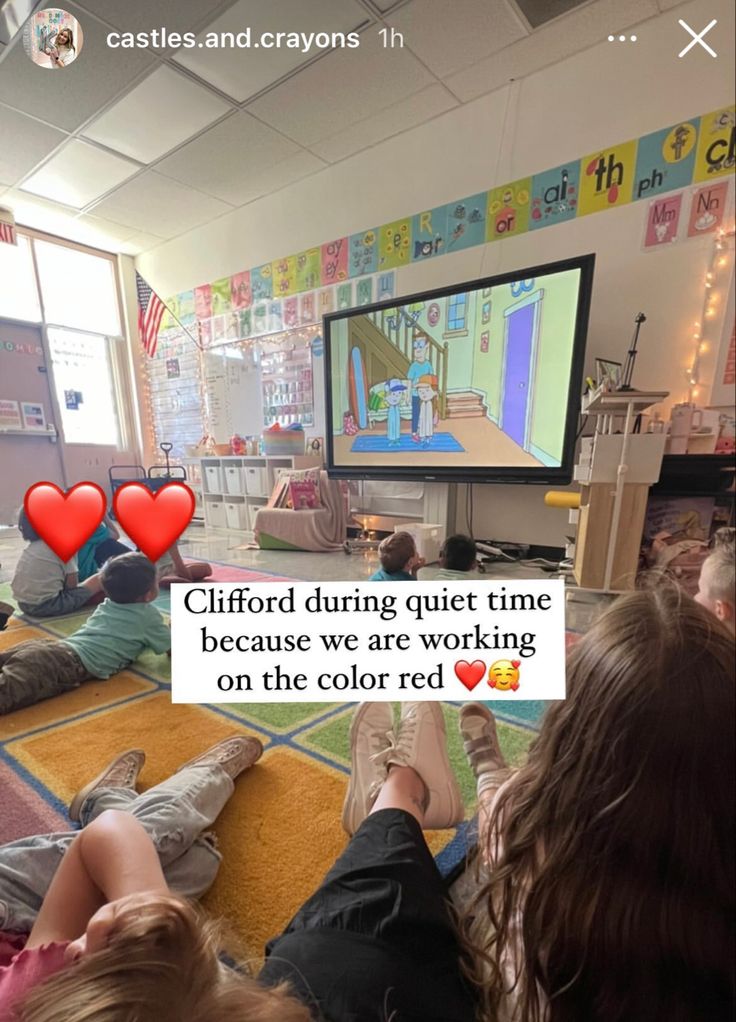 people sitting on the floor watching television with hearts in front of them and text reading cliffford during quiet time because we are working on the color red