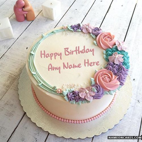 a birthday cake with frosting and flowers on it