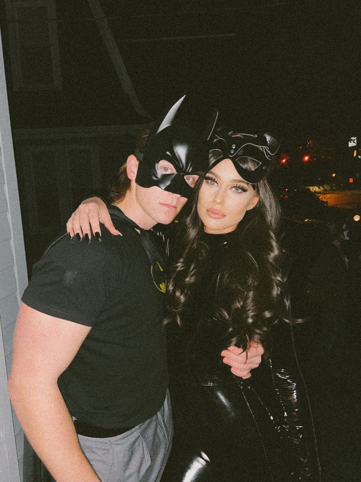 two people dressed up as batman and catwoman