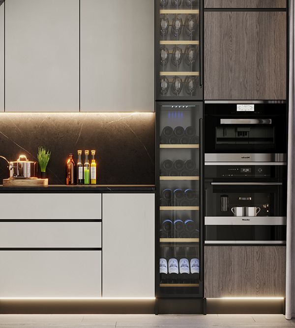 a kitchen with white cabinets and black counter tops, wine bottles on the shelves in front of the refrigerator