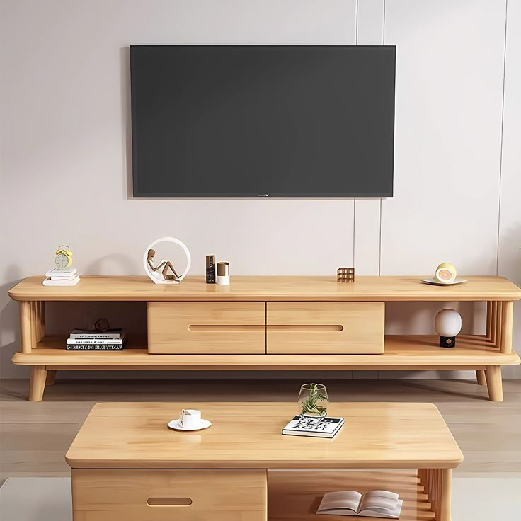 a living room scene with focus on the coffee table and entertainment center that's built into the wall