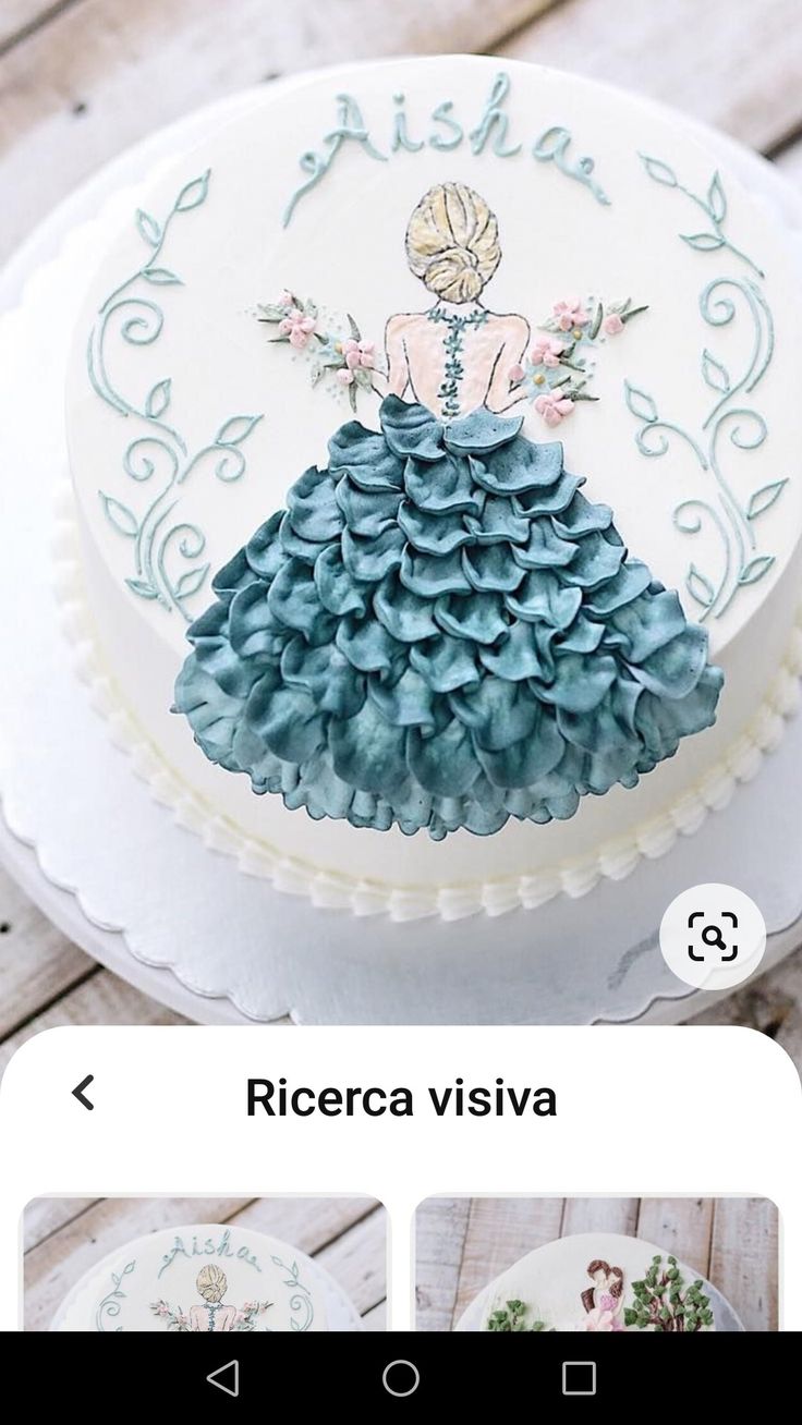 the cake is decorated with an image of a woman in a blue dress