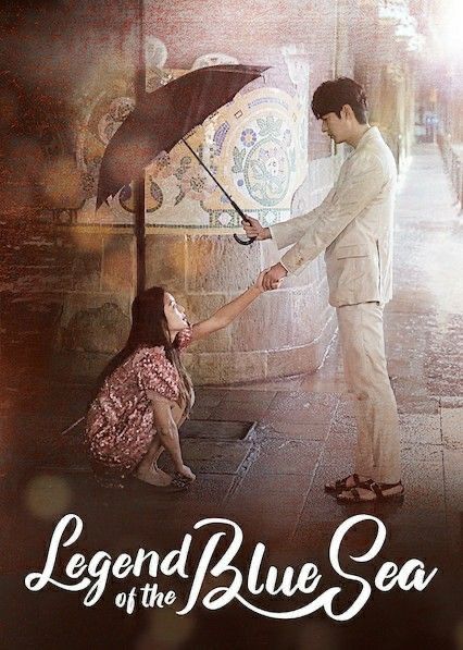 the poster for legend of the blue sea shows a man and woman holding an umbrella