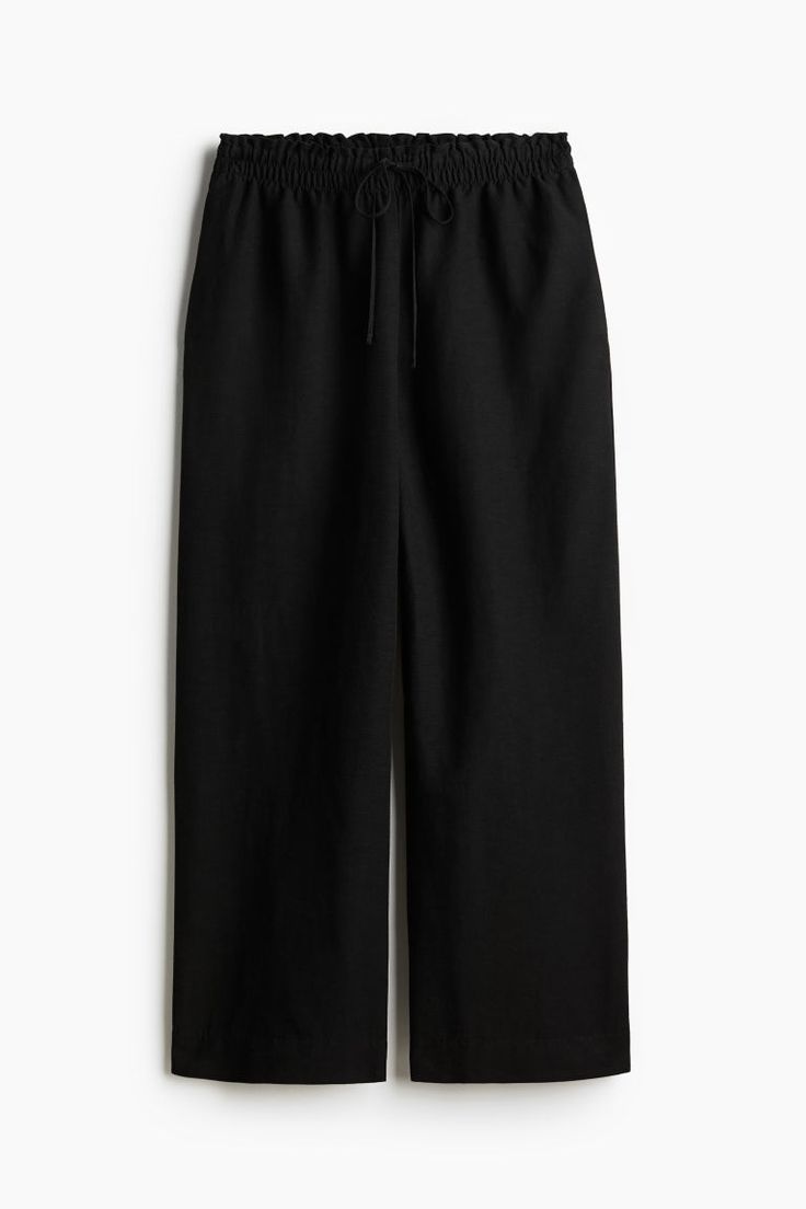 Loose-fit pants in an airy woven linen blend. High waist with ruffle trim  a narrow drawstring and smocked elastic at waistband  and discreet side pockets. Wide  ankle-length legs. Lookbook Casual, Black Linen Pants, Active Swimwear, Linen Blend Pants, Cardigan Sweater Dress, Cardigan Sweater Jacket, Blouse Pants, Kids Outerwear, Basic Shirts