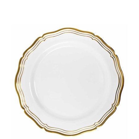 an empty white plate with gold trim