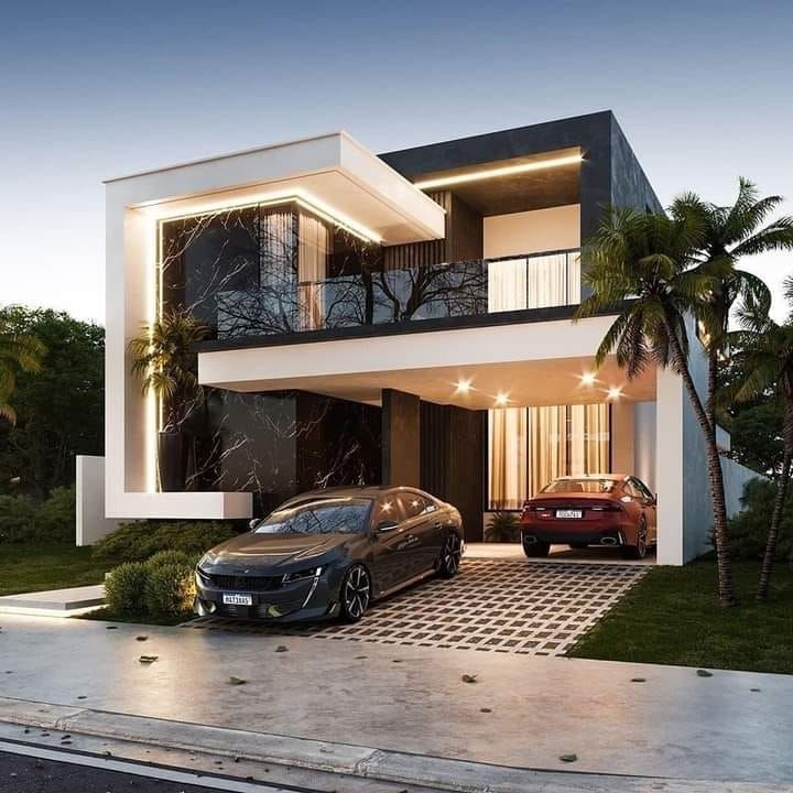 two cars parked in front of a modern house