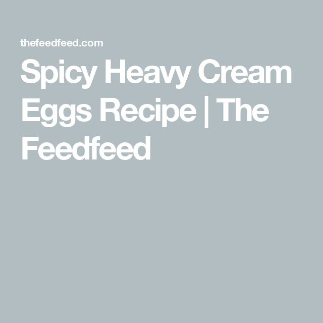 the text spicy heavy cream eggs recipe i the feded is in white on a gray background