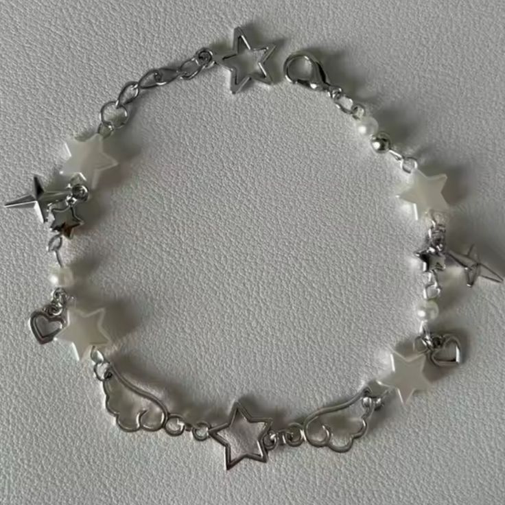 Chrome Winged Star Acubi Beaded Charm Bracelet Silver Handmade Bracelets, Bracelet Charms Pendants, Silver Wrist Stack, Letter Beaded Bracelets, Bracelet With Small Beads, Trendy White Beaded Bracelets For Party, Casual Star-shaped Jewelry For Parties, Charm Bracelet Business, Casual Star Charm Jewelry