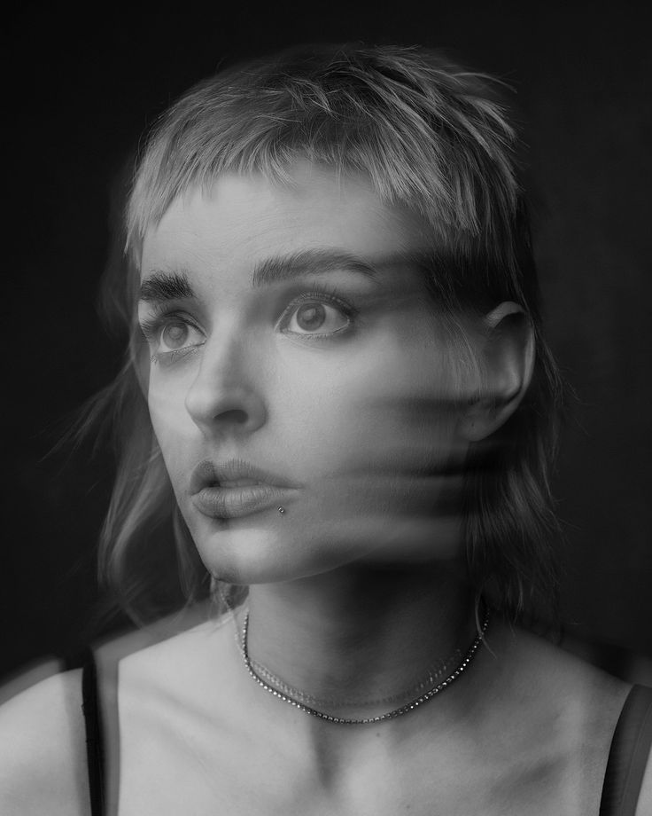 a black and white photo of a woman's face