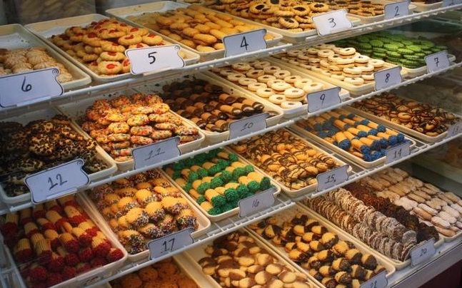 a display case filled with lots of different types of pastries