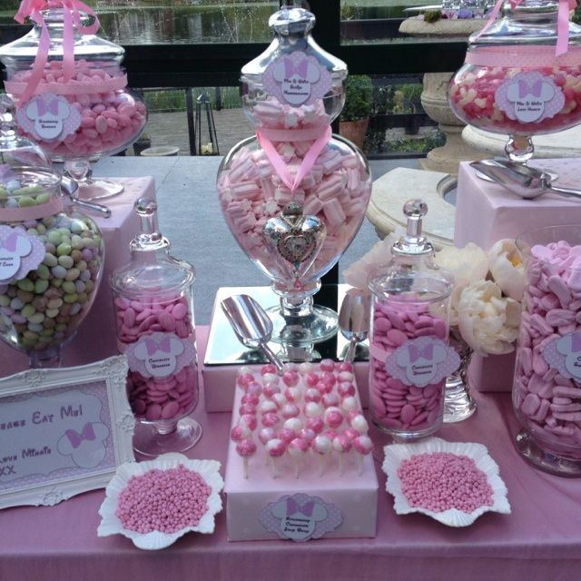 candy bar with pink and white candies, marshmallows, heart shaped lollipops