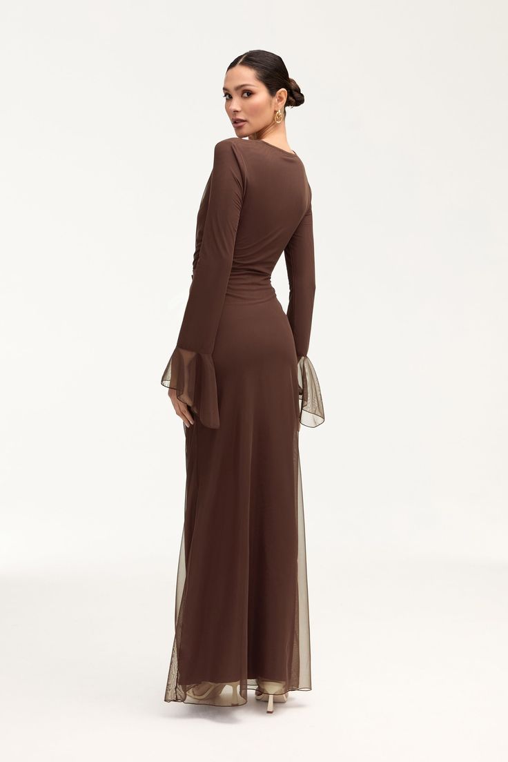 Elevate your wardrobe with our Capri Rouched Mesh Maxi Skirt in Espresso. Crafted from delicate mesh, this maxi skirt exudes sophistication. The rouched tie detailing at the waist adds a touch of luxury, making it the perfect addition to any elegant ensemble. Embrace timeless elegance with this exclusive piece. Model is 5'7" and is wearing size S/40.5". Please note this garment runs tight. We kindly recommend choosing one size up from your usual size. Long Sleeve Brown Maxi Dress, Hijabi Maxi Dress Outfit, Brown Modest Dress, Modest Maxi Dresses, Modest Birthday Dress, Brown Dress Wedding, Modest Holiday Outfits, Elegant Modest Dresses, Modest Graduation Outfit