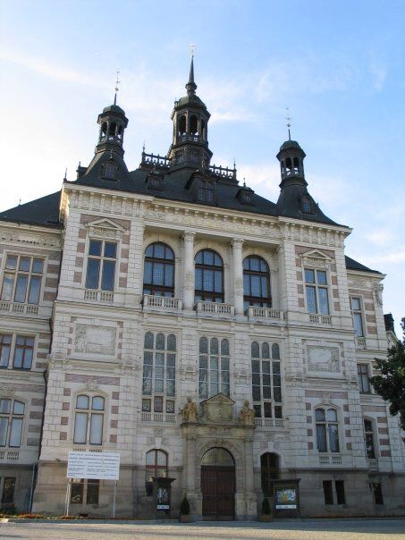 an old building with two towers on top