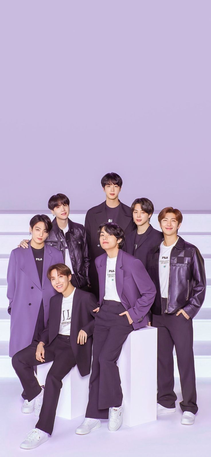 the members of btop are posing for a group photo in front of a purple background