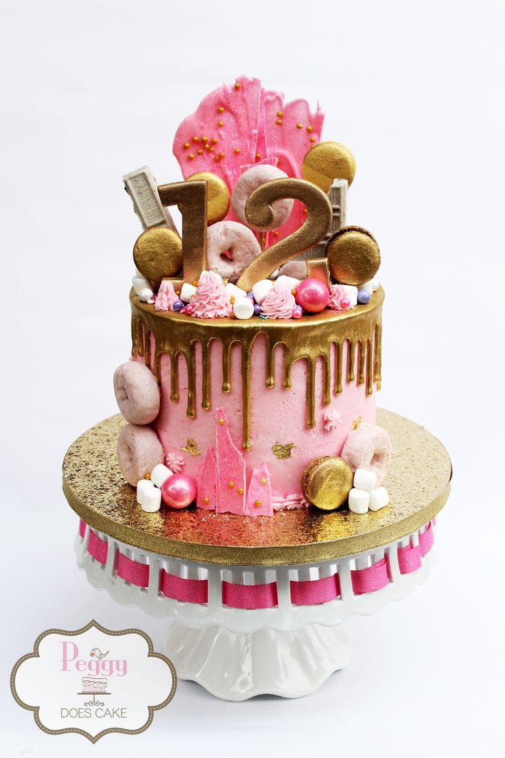 a pink and gold birthday cake with the number twenty five on top