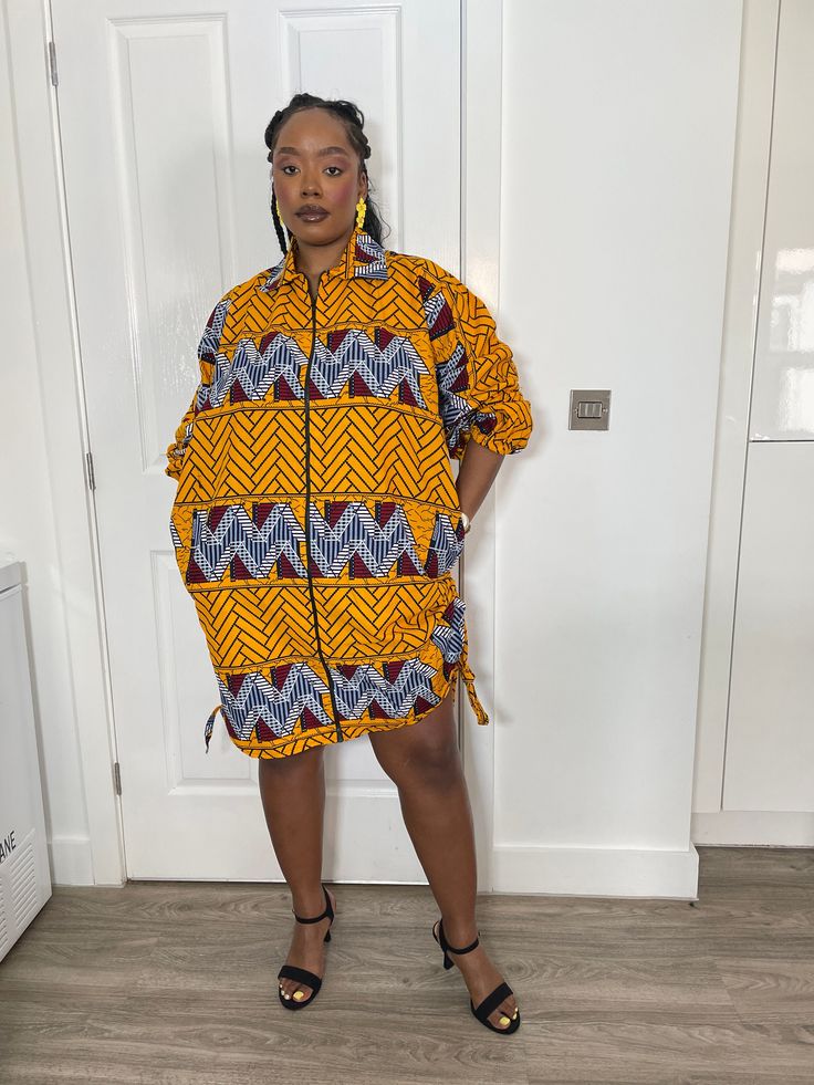 * Beautiful handmade Ankara shirt  dress with side pockets. *  Dress has a full front zip down, side pockets and a self tie belt. *  Dress has a high low design to the dress hem that can be adjusted. A copy of our size chat has  been added to photo collage, please check your size before placing your order, as we will not be responsible for incorrect sizes. If you have any inquiries, please feel free to start an etsy conversation CARE INSTRUCTIONS *Hand wash with warm water. *Do not bleach. *Allo Ankara Shirt Dress, Ankara Dress, African Print Dress, Hem Dress, African Attire, Ankara, Front Zipper, African Clothing, African Print