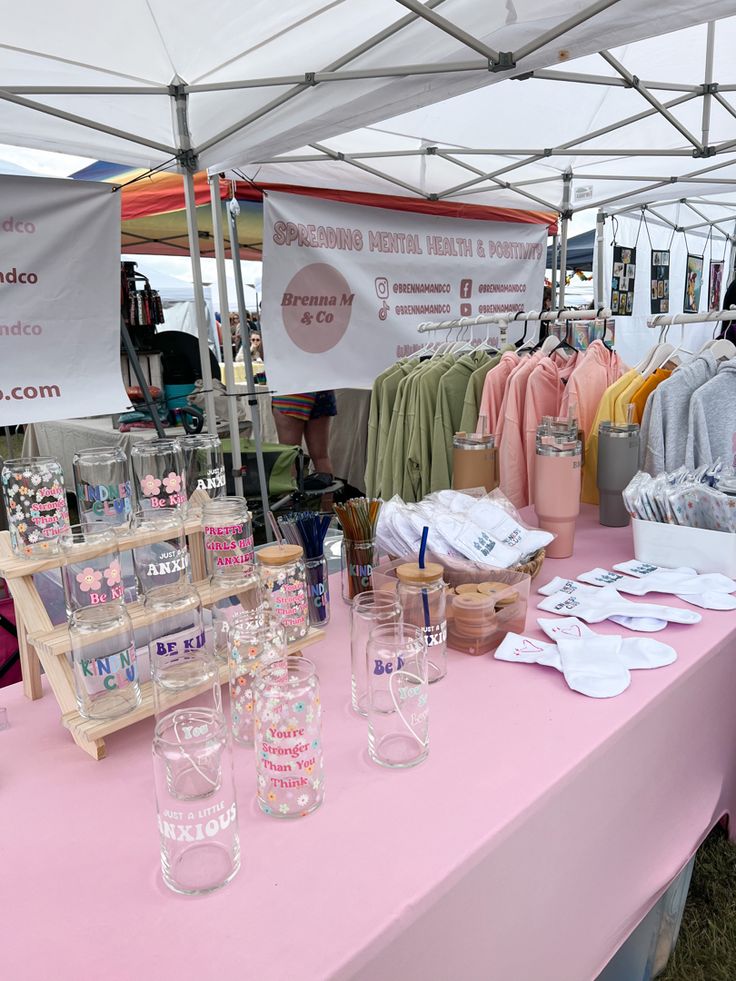 a pink table topped with lots of glasses