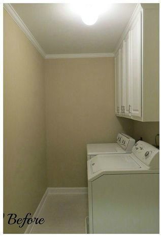 the laundry room is clean and ready to be used as a washer and dryer