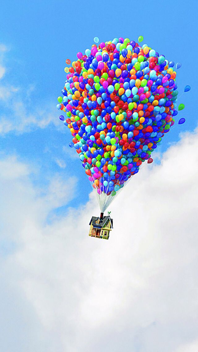 a house floating in the air with balloons attached to it's sides and bottom