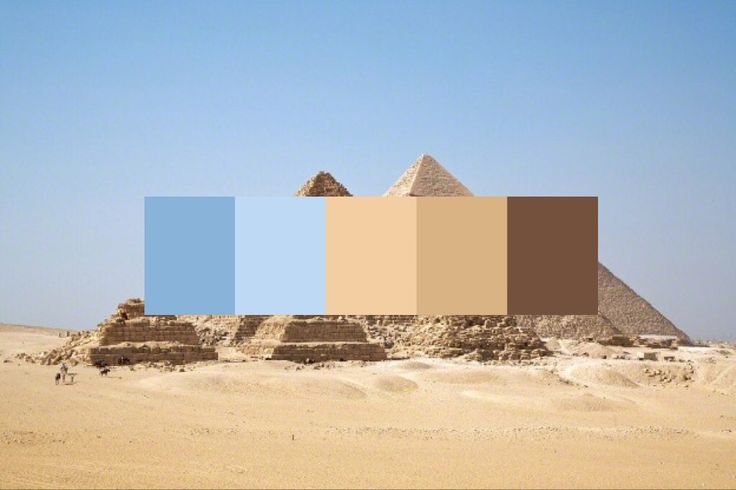 three pyramids in the desert with blue, brown and tan colors on them's sides