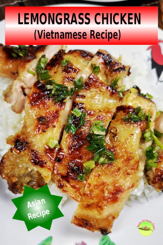 a plate topped with chicken and rice covered in green herbs next to a red sign