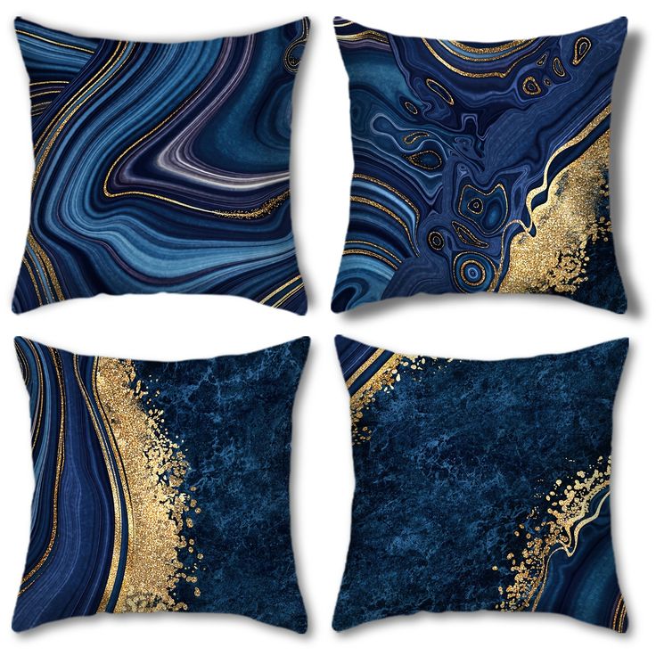 four blue and gold decorative pillows on a white background, each with an abstract design