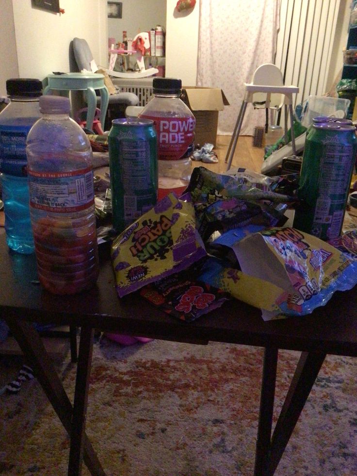 the table is full of snacks and water bottles