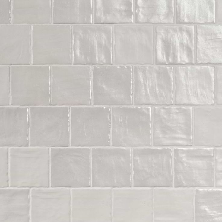 a white tile wall that is very clean