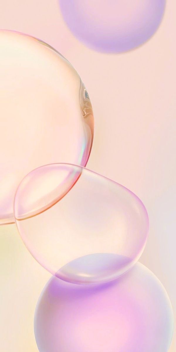 an abstract image of soap bubbles floating in the air on a pink and yellow background