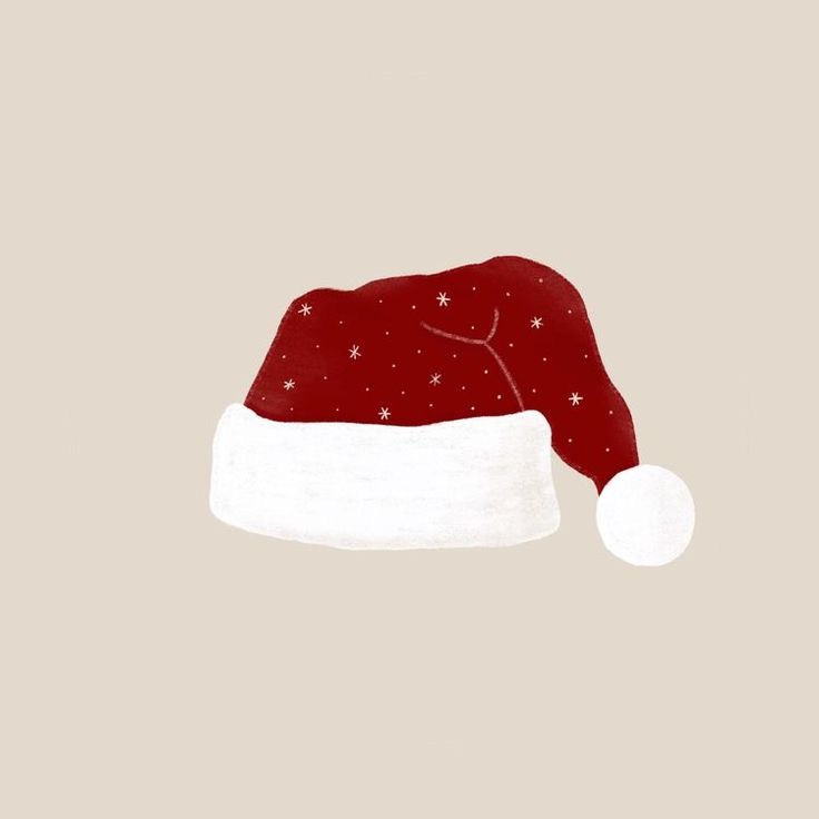 a red santa hat with white stars on the side and a light brown back ground