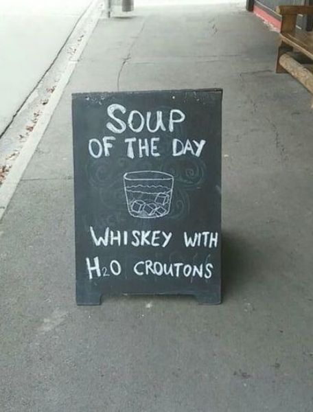 a sign that says soup of the day whiskey with h o croutons