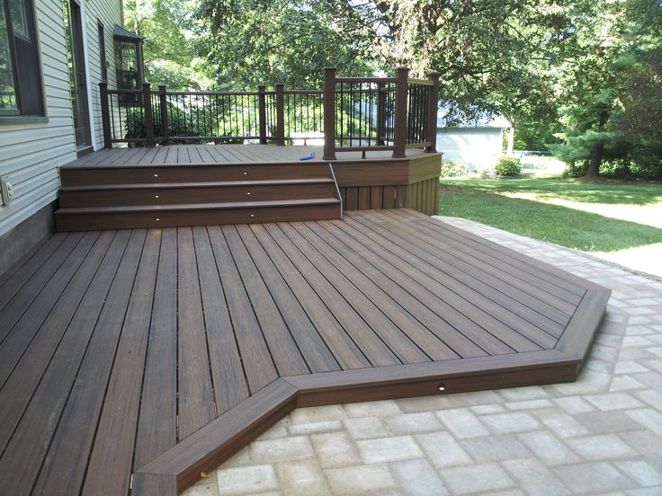 a wooden deck with steps leading up to it