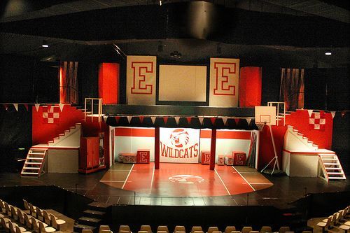 an empty stage with red and white walls