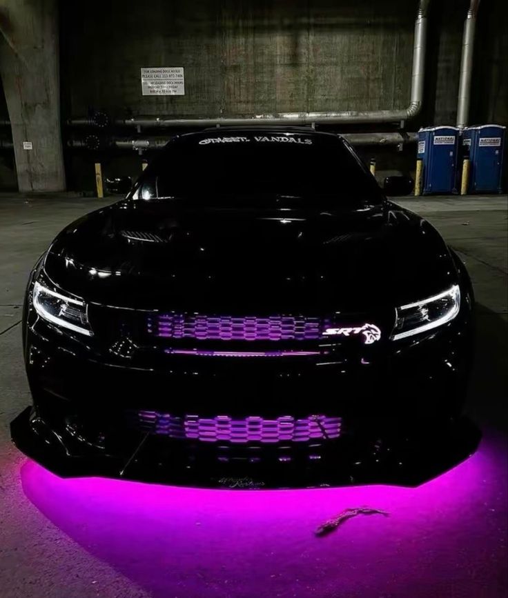 a black car with purple lights on it