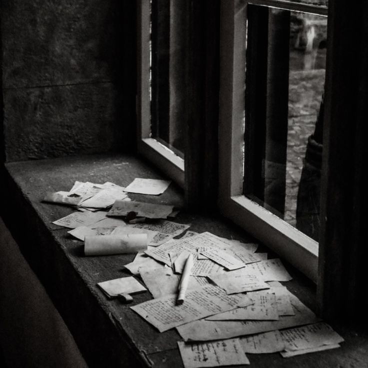 a window sill that has papers on it