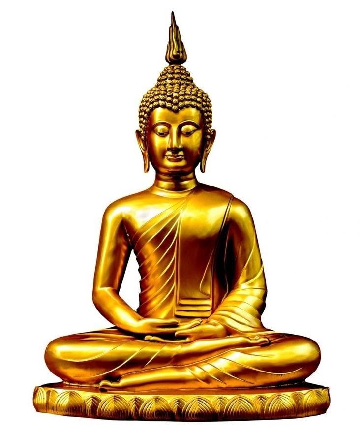 a golden buddha statue sitting on top of a white surface