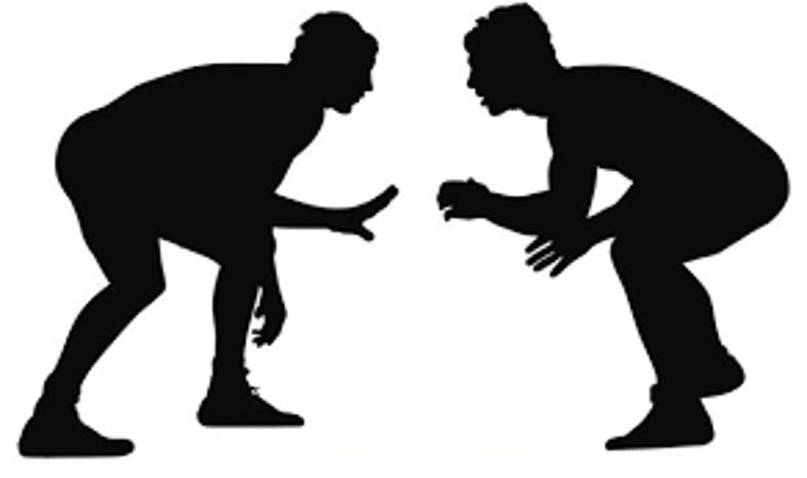 two men are facing each other in silhouette