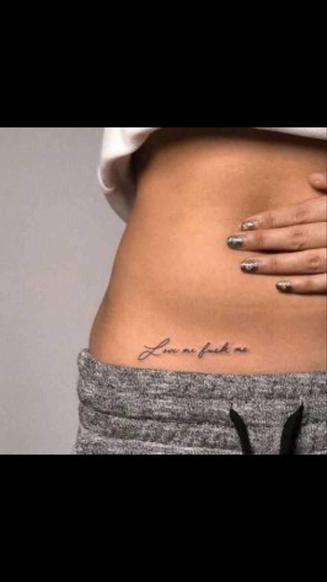 a woman's stomach with tattoos on it and the words love you written in cursive writing