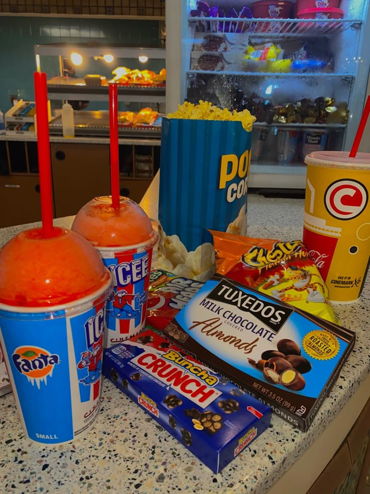 an assortment of snacks and drinks on a counter