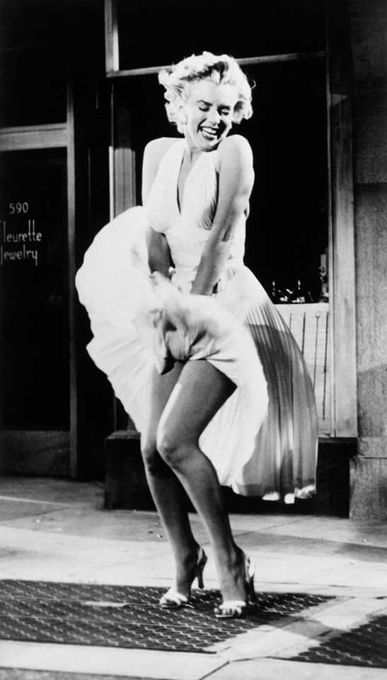 an old black and white photo of a woman dancing