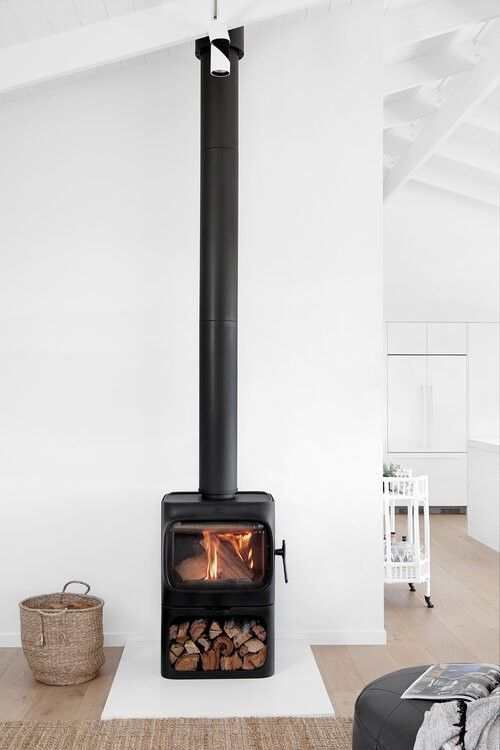 an open fire place in a white room