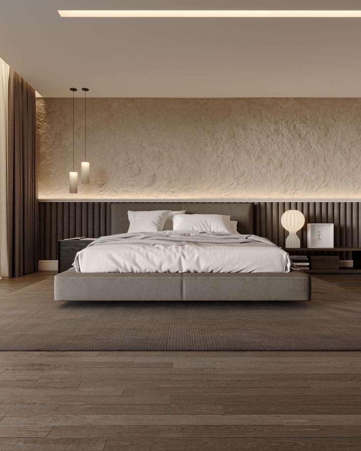 a large bed sitting on top of a wooden floor