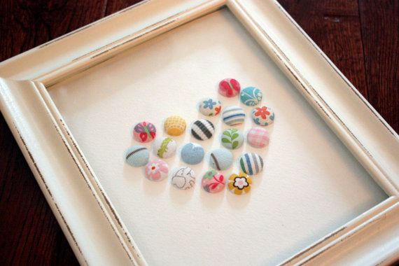 a white frame with some colorful buttons in it