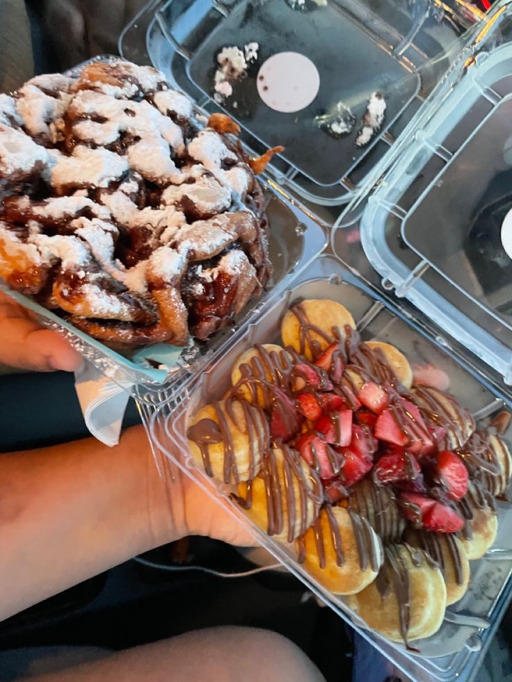 three plastic containers filled with desserts and pastries