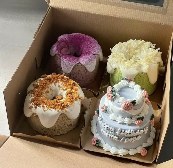 three different types of cakes in a box