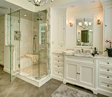 a large bathroom with two sinks and a walk in shower